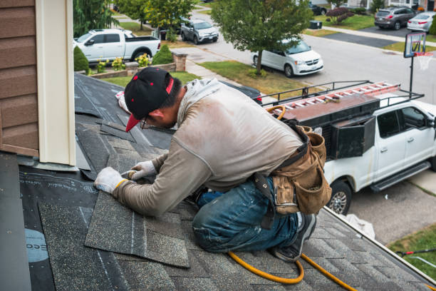 Professional Roofing technician working in Okemos, MI